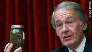 Rep. Ed Markey, D-Massachusetts, holds up a jar of oil taken from the Gulf of Mexico during a hearing.