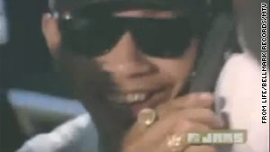 Conspiracy theorists say the cool cat in the "Whoomp (There It Is)" video could be a young Barack Obama.
