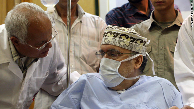 Freed Lockerbie bomber Abdelbaset Ali Mohmed al Megrahi talks to a doctor at a hospital in Tripoli, Libya, in September.