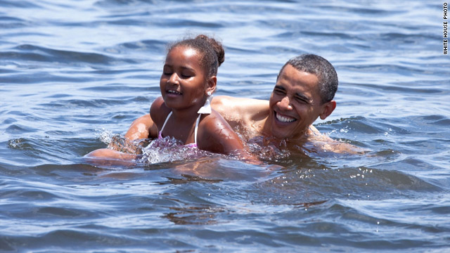 President Obama and daughter Sasha swim at Panama City Beach, Florida, in this released on the White House's Flickr page.