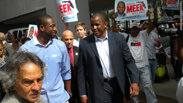 Basketball star Dwyane Wade, left, walks with Florida Democratic senatorial candidate Kendrick Meek Thursday to vote early.