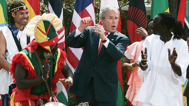 President George W. Bush dances with members of a West African troupe at the White House in April 2007.