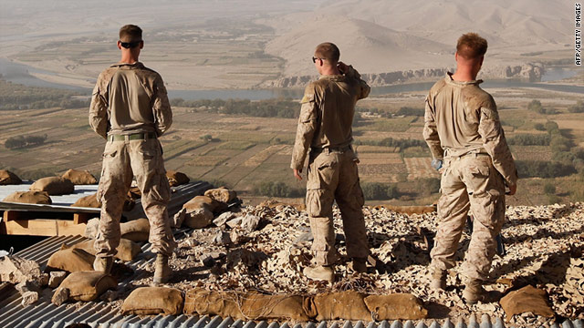 U.S. Marines look out over the Helmand River from an outpost in Kajaki, Afghanistan.