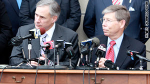 Texas Attorney General Greg Abbott, left, and Florida Attorney General Bill McCollum discuss the case.