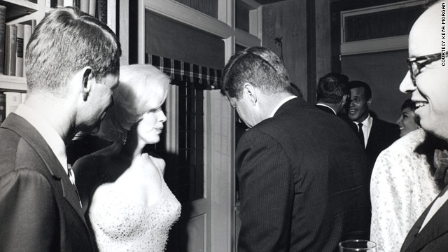 Robert F. Kennedy, left, Marilyn Monroe and President John F.  Kennedy in 1962 photo taken by Cecil Stoughton. Historian Arthur  Schlesinger is on the far right. Singer Harry Belafonte can be seen  facing the camera in the rear