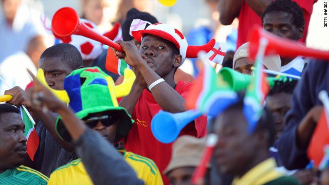 Fans at the 2010 FIFA World Cup in South Africa blow vuvuzelas during a game.