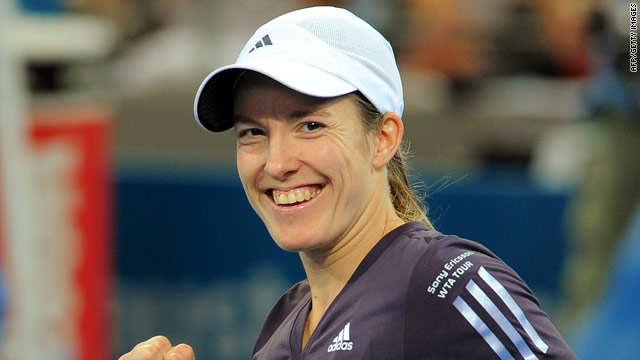 Justine Henin is all smiles after winning her comeback match at the Adelaide International tournament.