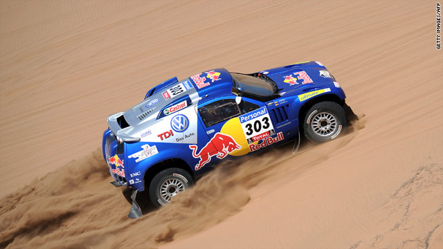 Volkswagen driver Carlos Sainz claimed victory in the 12th stage of the Dakar Rally to maintain his overall lead.