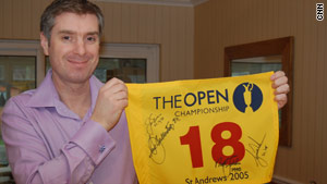 CNN's Don Riddell with the signed flag that will be auctioned to help those in Haiti.