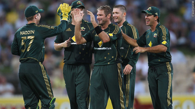 Ryan Harris is mobbed by his teammates after taking five wickets to help Australia defeat Pakistan in Adelaide on Tuesday.