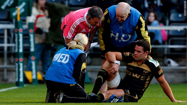 Lee Byrne receives treatment on the field during the Osprey's European Cup win against the Leicester Tigers.