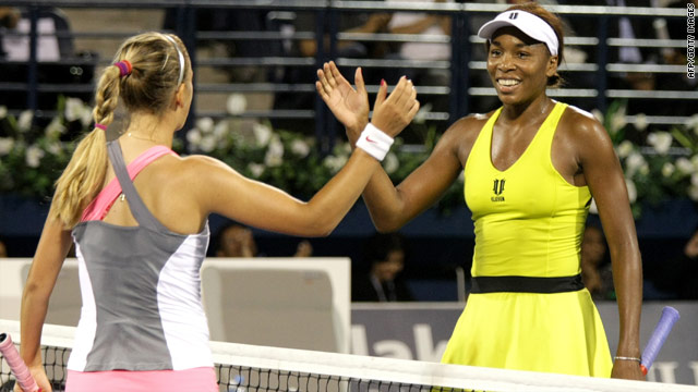 A delighted Venus Williams, right, shakes hands with her defeated final opponent Victoria Azarenka.