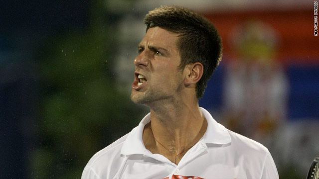 Novak Djokovic shows his delight after defeating Marcos Baghdatis in a tight semifinal in Dubai.