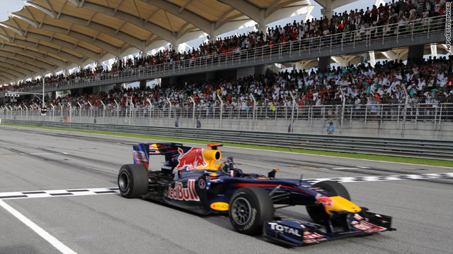 Sebastian Vettel crosses the finish line to secure a comfortable victory in the Malaysian Grand Prix at Sepang.