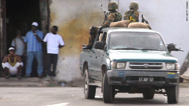 Members of the Jamaica Defense Force patrol a section of western Kingston on May 24.