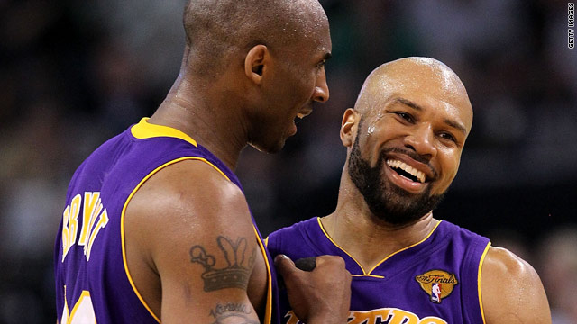 Kobe Bryant congratulates teammate Derek Fisher after the L.A. Lakers 91-84 win over the Boston Celtics on Tuesday