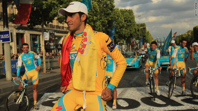 Alberto Contador celebrates his Tour de France victory with his Astana teammates in the background.