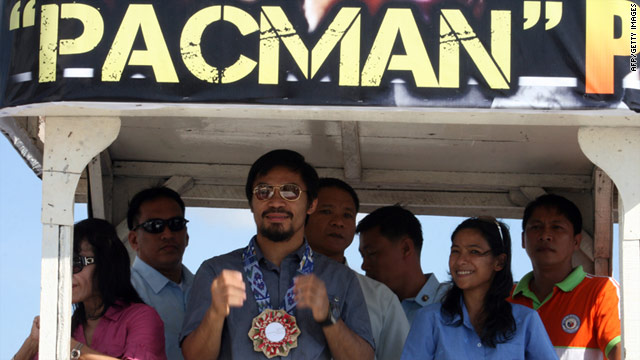 Manny Pacquiao greets the crowds in his native Philippines.