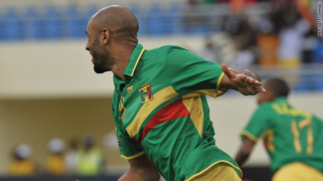 Frederic Kanoute celebrates scoring Mali's opening against Malawi, but their 3-1 win was not enough to see them reach the last eight of the African Nations Cup.