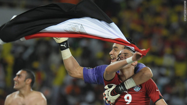 Egypt players celebrate winning the Africa Cup of Nations title for a third successive time with a 1-0 victory over Ghana.