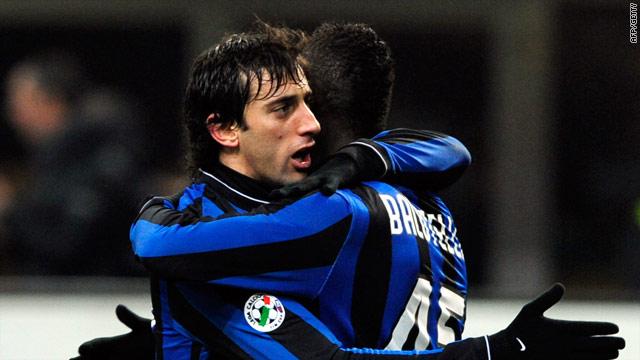 Milito is congratulated after scoring the crucial goal for Inter in the San Siro.