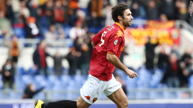 Mirko Vucinic wheels away after scoring the only goal of the game in the Stadio Olimpico.