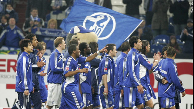 Schalke's Royal Blues stayed in the Bundesliga title race with a derby win over Borussia Dortmund.