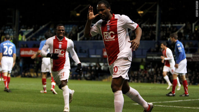 Cameron Jerome celebrates opening the scoring in Birmingham's 2-1 Premier League victory at Portsmouth.
