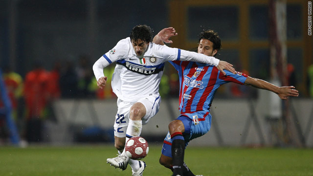 Diego Militio (left) tries to evade the Catania defence as the Italian leaders slumped to a shock 3-1 defeat.