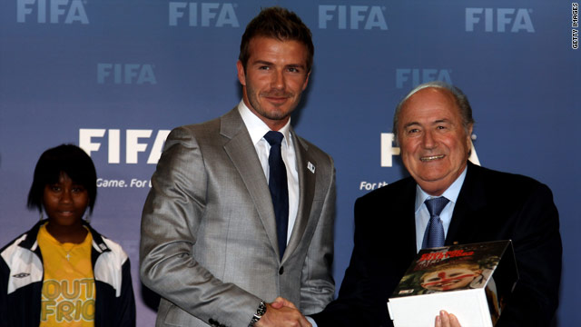 David Beckham hands over the official England bidding book to FIFA president Sepp Blatter.