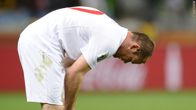 Down but not yet out. Wayne Rooney contemplates their goalless draw against Algeria.