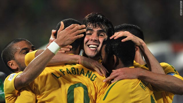 Kaka (center) celebrates with team-mates after Luis Fabiano scores Brazil's second goal.