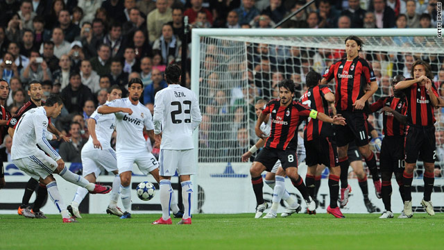 Cristiano Ronaldo fires Real Madrid's opening goal as the AC Milan wall disintegrates to allow his free-kick through.
