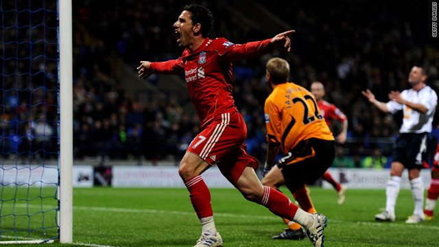 Maxi Rodriguez celebrates his late goal as Liverpool secured a vital 1-0 victory at Bolton.