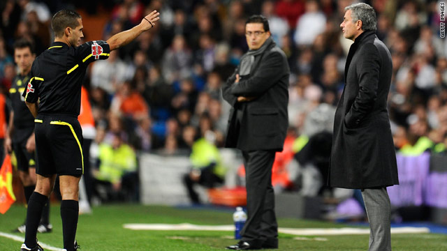Jose Mourinho, right, was far from happy with Paradas Romero's decision to book Mahamadou Diarra.