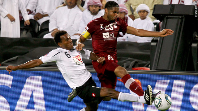 Hekari United midfielder Abraham Iniga, left, challenges Al-Wahda defender Haidar Alo Ali at the Club World Cup.