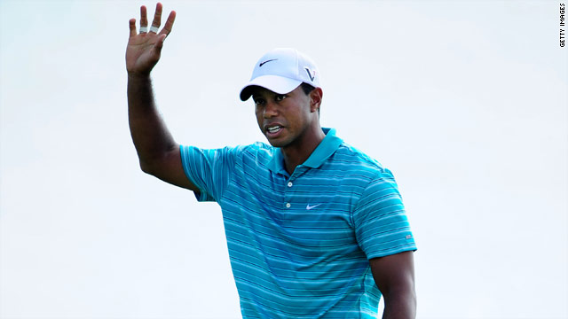 Tiger Woods salutes the crowd after a successful birdie putt at the 17th hole at Whistling Straits on Saturday.