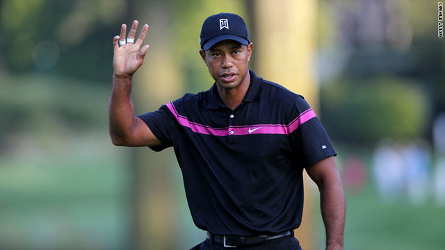 Woods celebrates one of his seven birdies during a fine opening round at The Barclays.