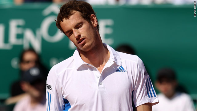 Andy Murray cuts a dejected figure after his straight sets defeat in the second round in Monte Carlo.