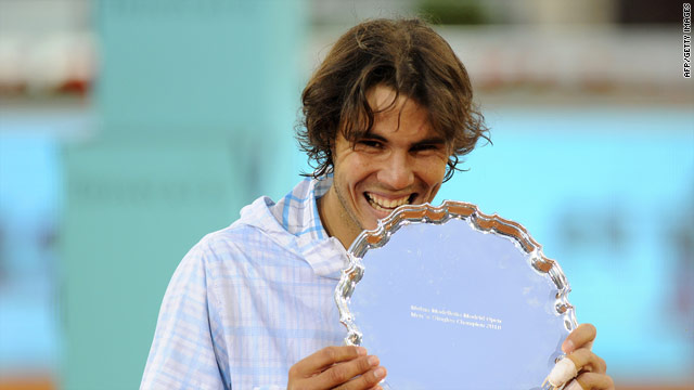 Rafael Nadal in familiar pose after defeating Roger Federer to remain unbeaten on his favored clay-courts this season.