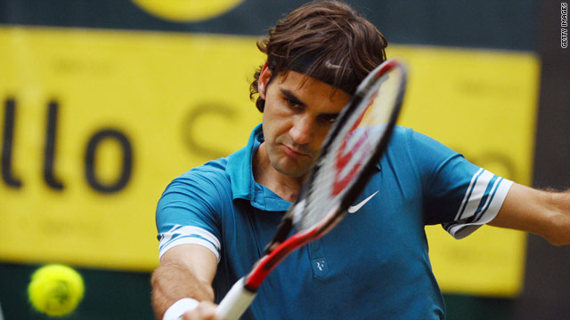 Roger Federer is the picture of concentration as he plays a 
backhand during his semifinal win in Halle.