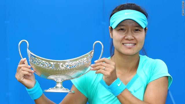 Li Na of China holds aloft the Aegon Classic trophy after her victory over Maria Sharapova