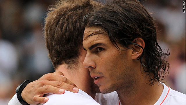 Rafael Nadal consoles Andy Murray after inflicting a straight sets defeat on the Scot.