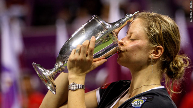 Kim Clijsters kisses her trophy after winning the WTA Championship title by defeating Caroline Wozniacki.