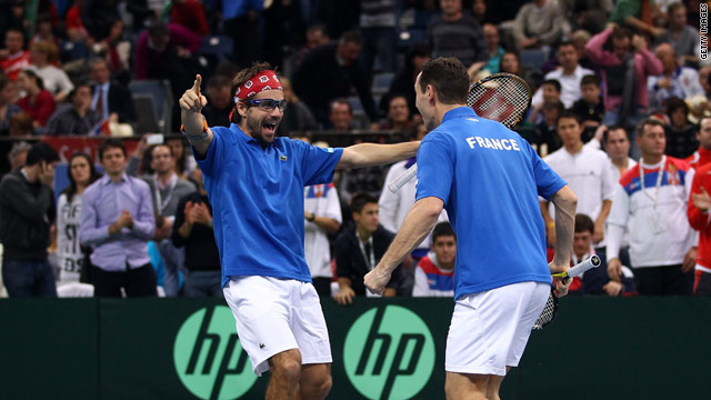 Arnaud Clement and Michael Llodra savor their moment of victory in the vital doubles in Belgrade.
