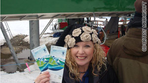 Blogger Amber Johnson shows off tickets to watch her son's namesake, skier Bode Miller, compete.