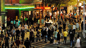 People flood 6th Street in Austin, Texas, during the annual South by Southwest Conference.