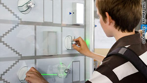 A child explores lasers at Germany's TRUMPF LaserLab, a center designed to inspire interest in the technology.