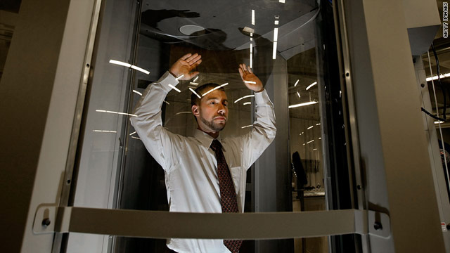 A volunteer stands inside a body scanner during a demonstration at the TSA's integration facility in Arlington, Virginia, last month.