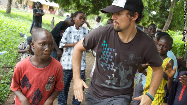 Jason Mraz shows off some dance moves with Abeiku, one of the children he met during his trip to Ghana.